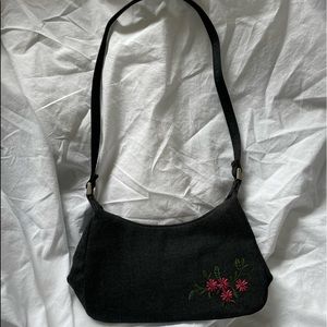 Ladies purse with needlepoint.